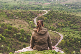 Young woman looking out in front of her journey