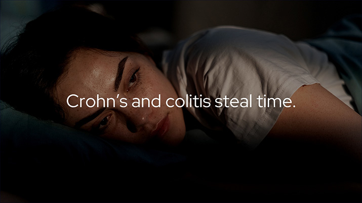 A woman with IBD experiencing pain and discomfort