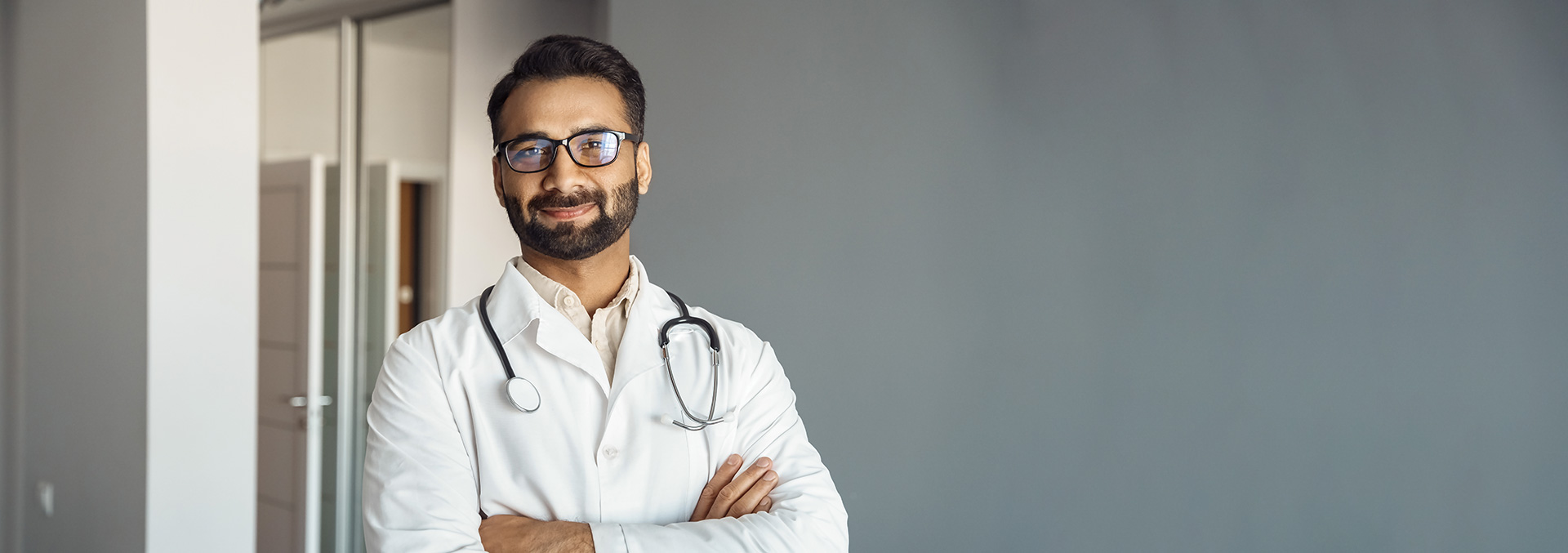 An IBD Physician wearing a smock