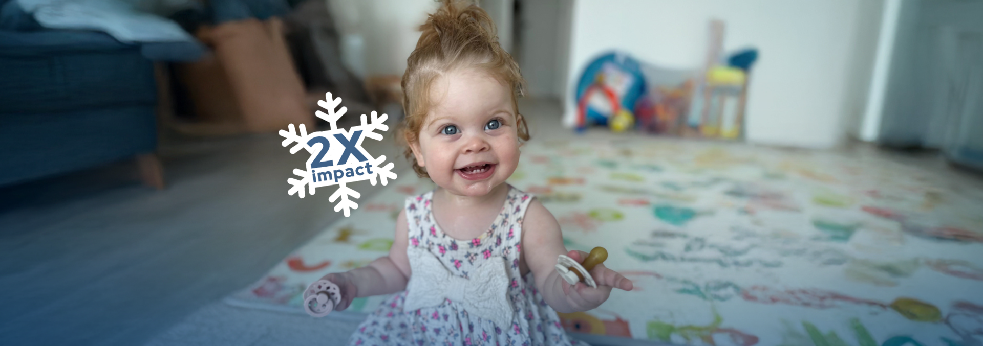 A young baby with IBD holding a pacifier