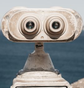 binoculars with ocean in the background