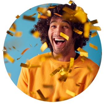 A man celebrating with confetti in the air