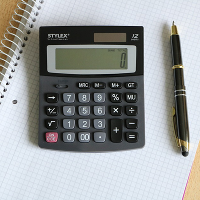 Calculator, notebook and pen