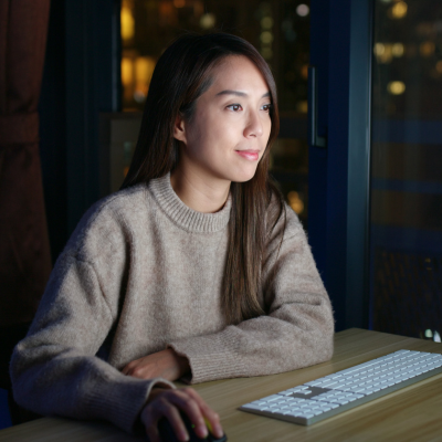 Woman sitting looking at her computer