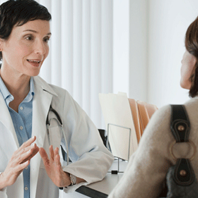Physician talking to her patient